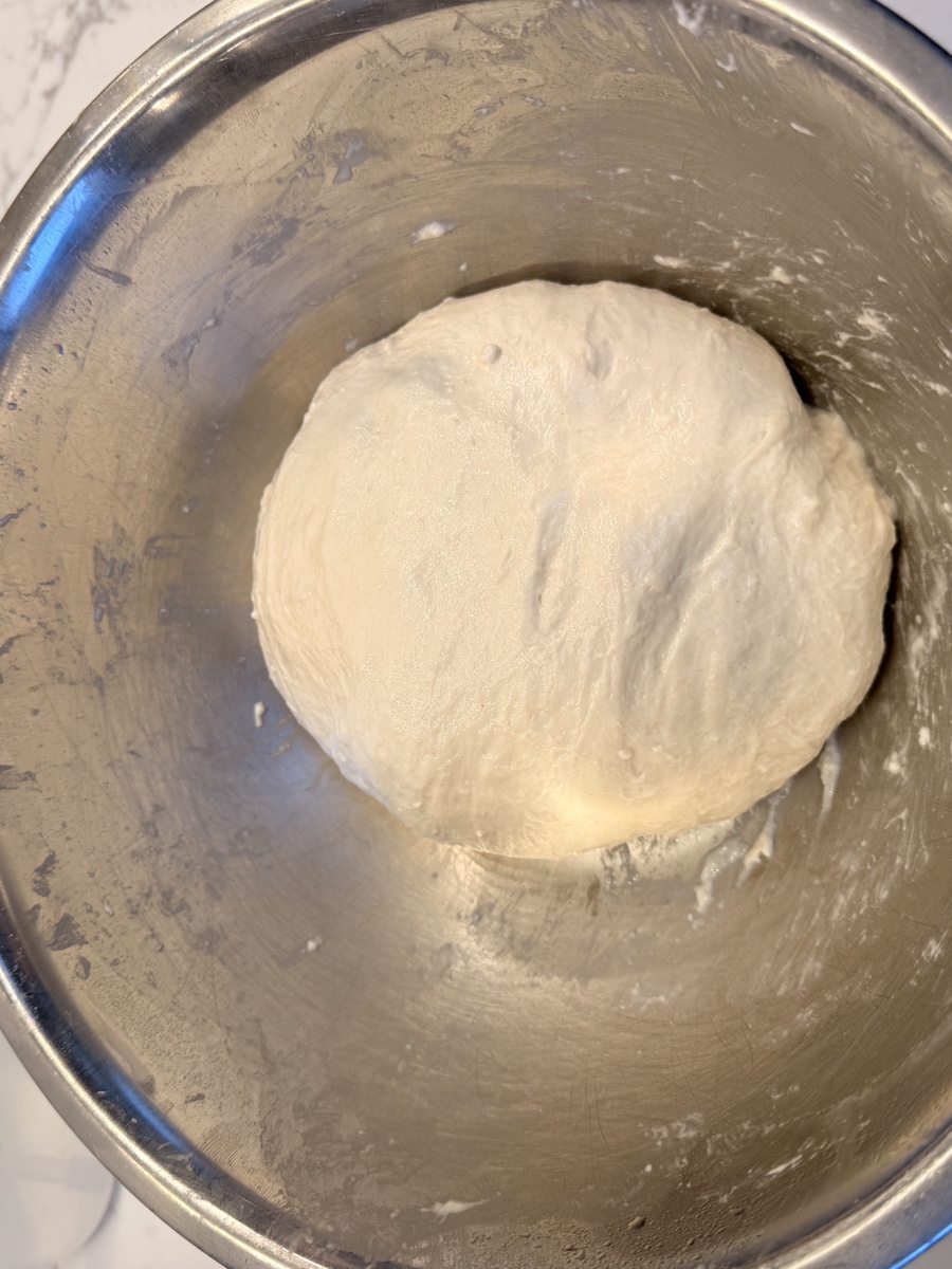 Dough after third stretch and fold showing smooth, strong structure