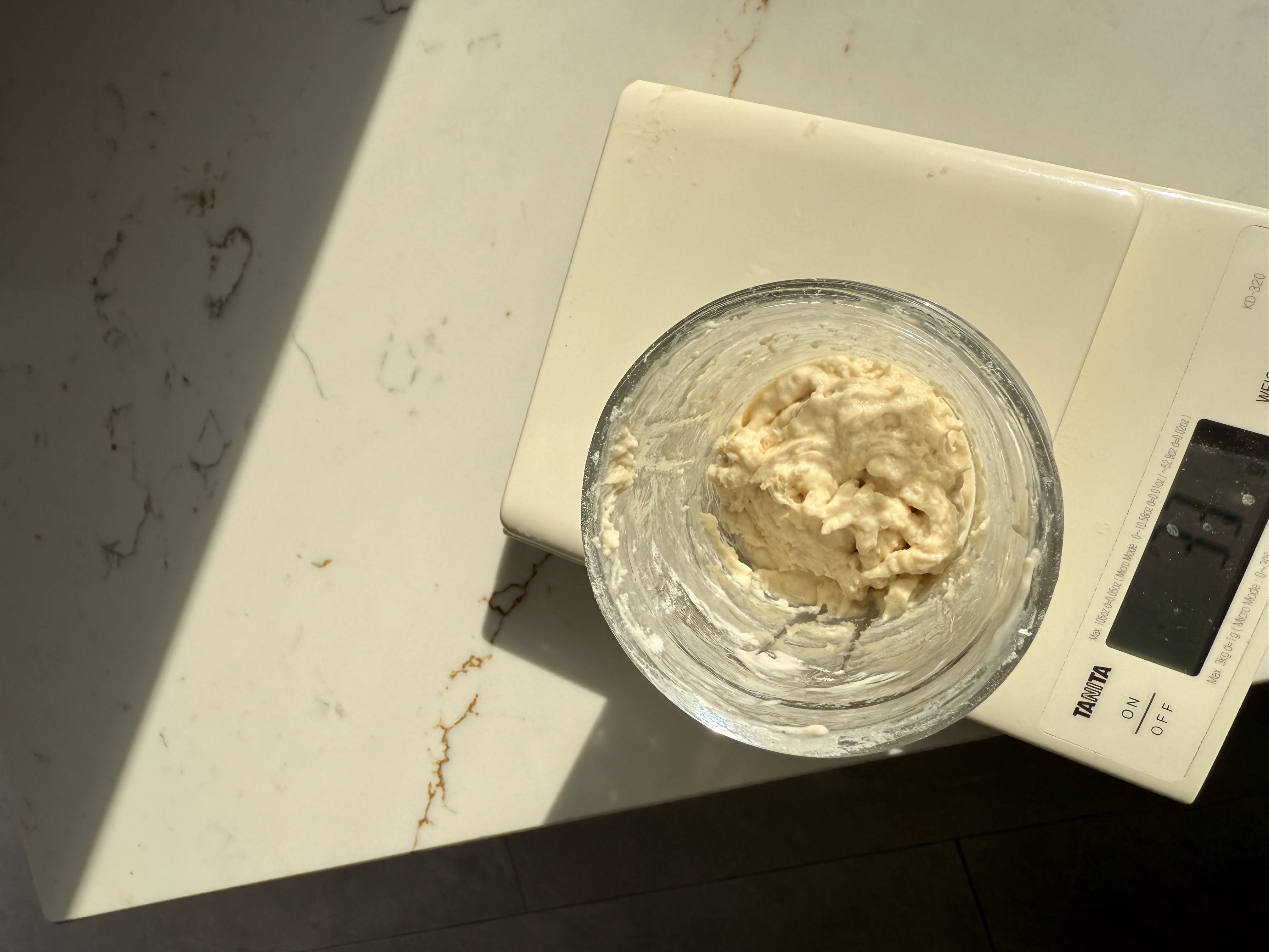 Sourdough starter mixed to a thick paste consistency consistency after feeding